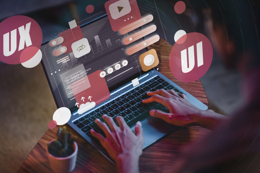 A modern and visually engaging UI/UX portfolio website displayed on a laptop screen, featuring creative design elements and project thumbnails.